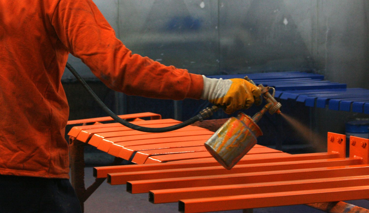 Coated paint and color draw-down panels being prepared for spectrophotometer measurement