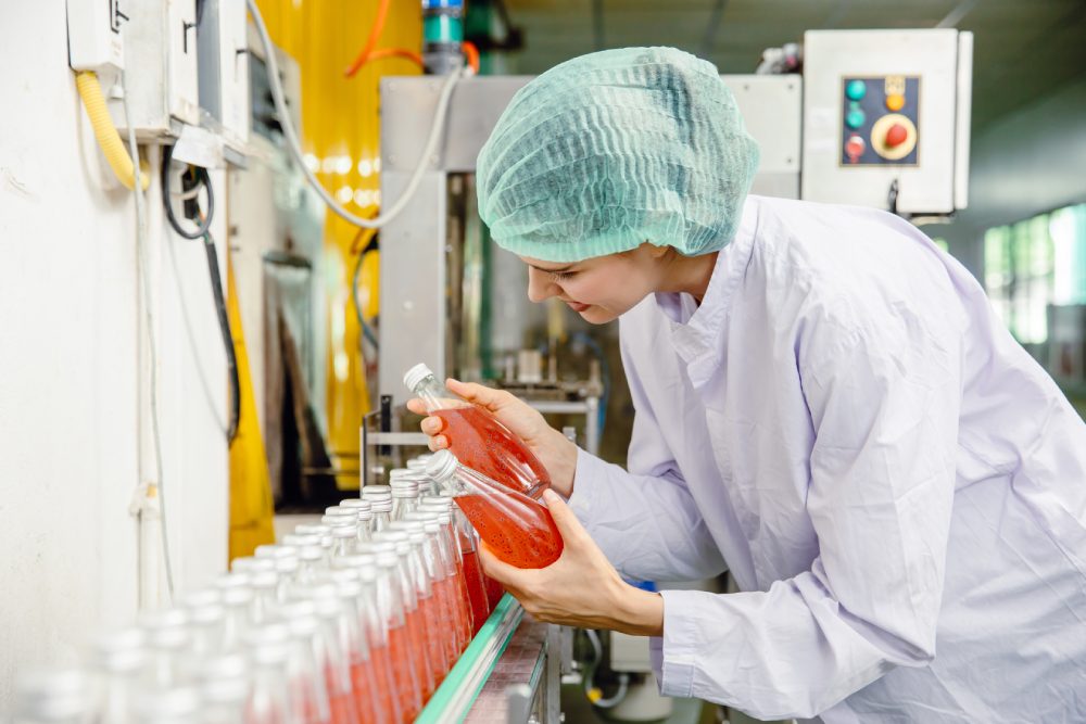 Food laboratory technician inspecting an ingredient sample