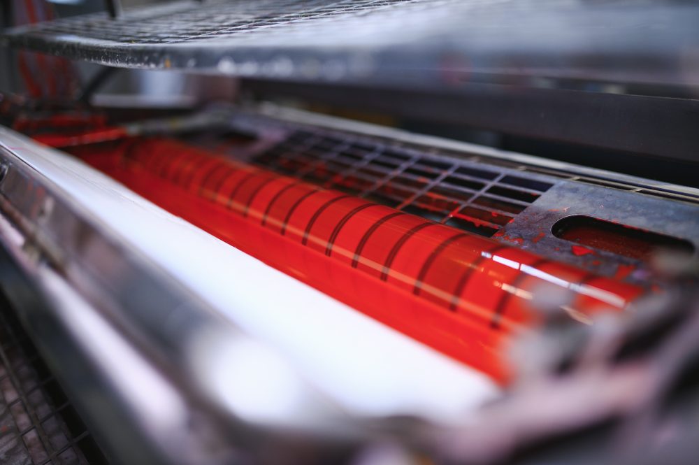 Packaging material moving through a printing press